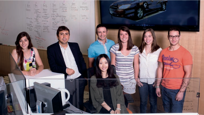 Professor Hamdar standing with 6 of his student lab members