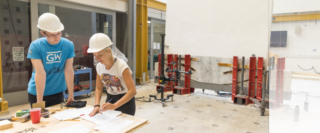2 people working in the Highbay at the Science and Engineering Hall