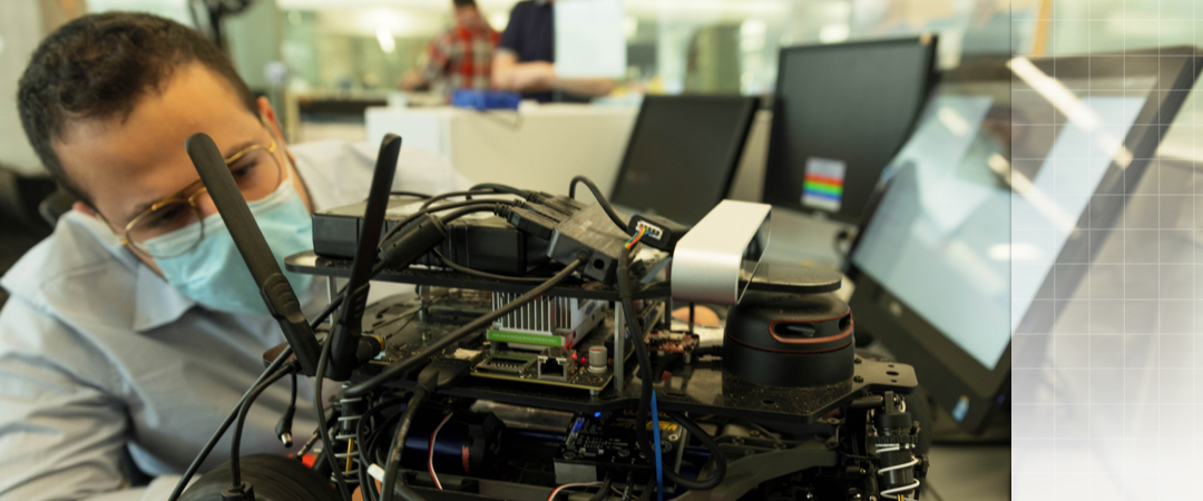researcher working on a machine