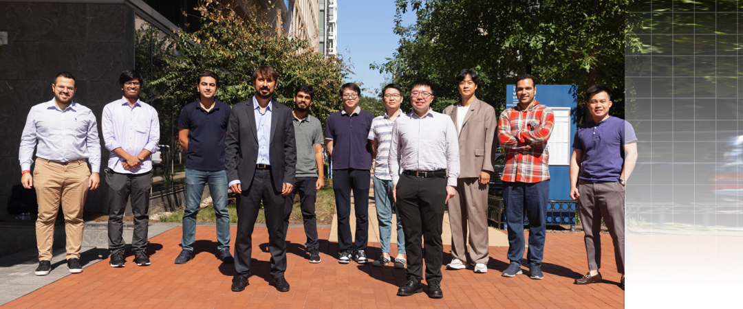 group of students and Professor Hamdar standing outside of the science and engineering hall 