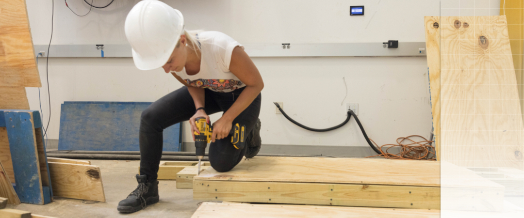 Person drilling into wood