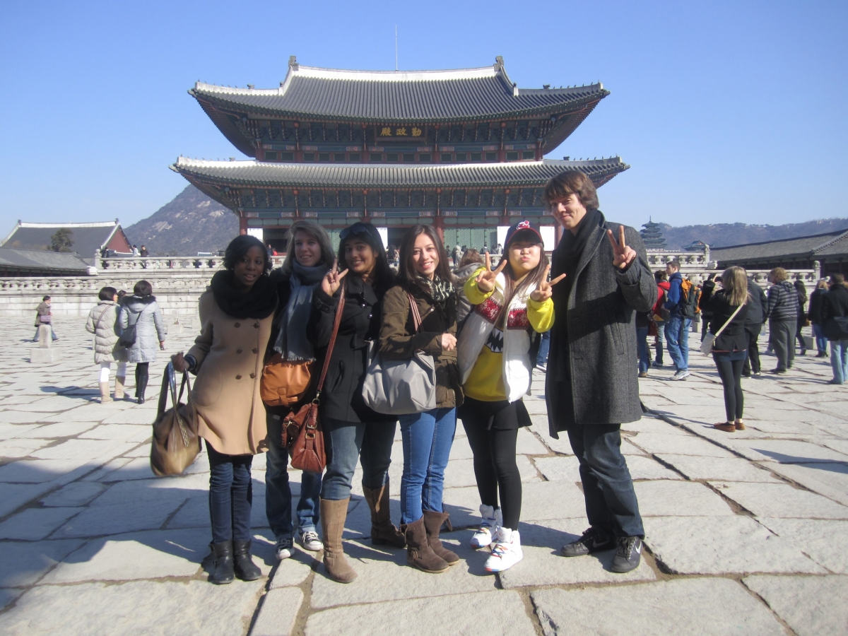 group of students in front of Korean temple