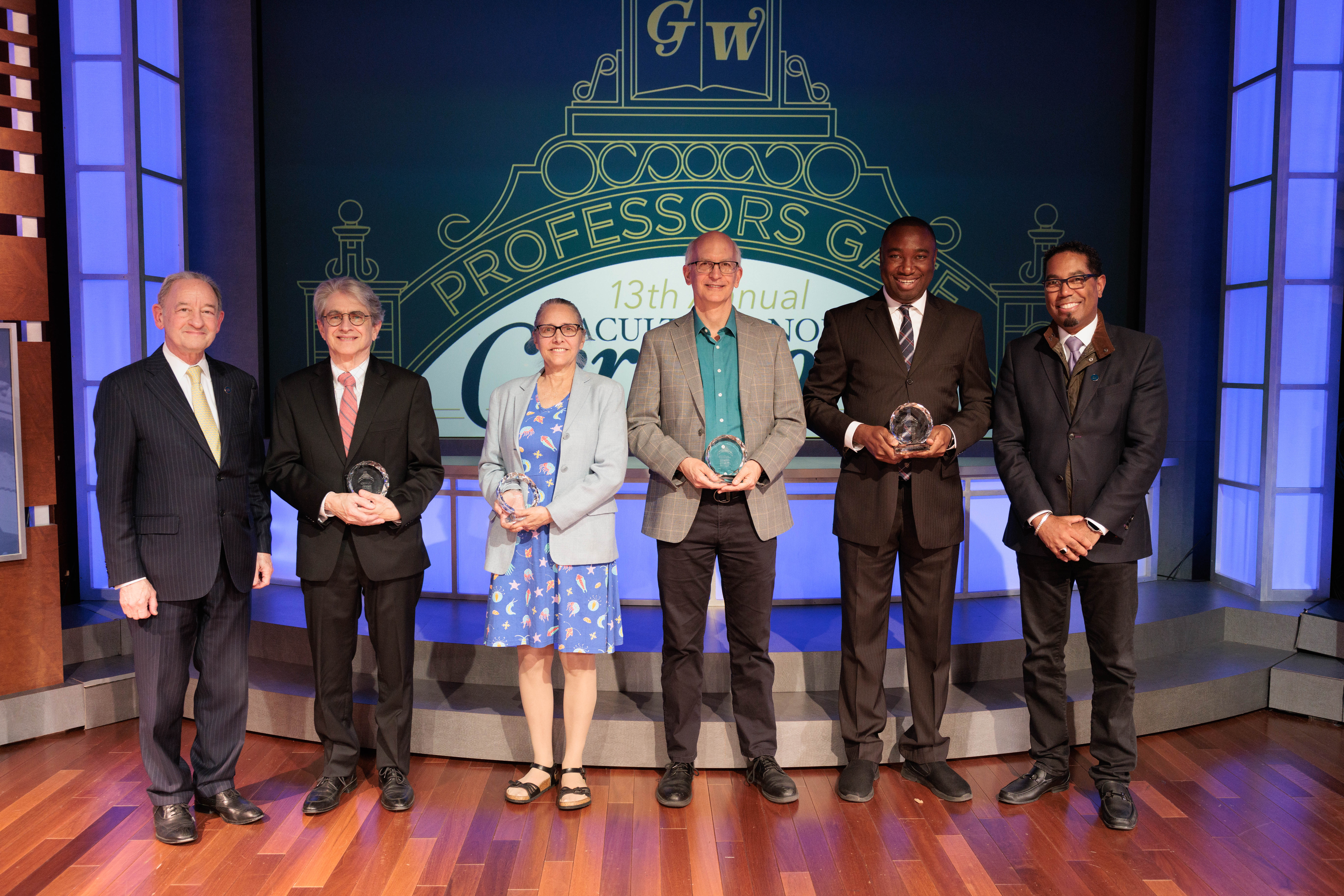 Faculty honors winners pictured with their awards