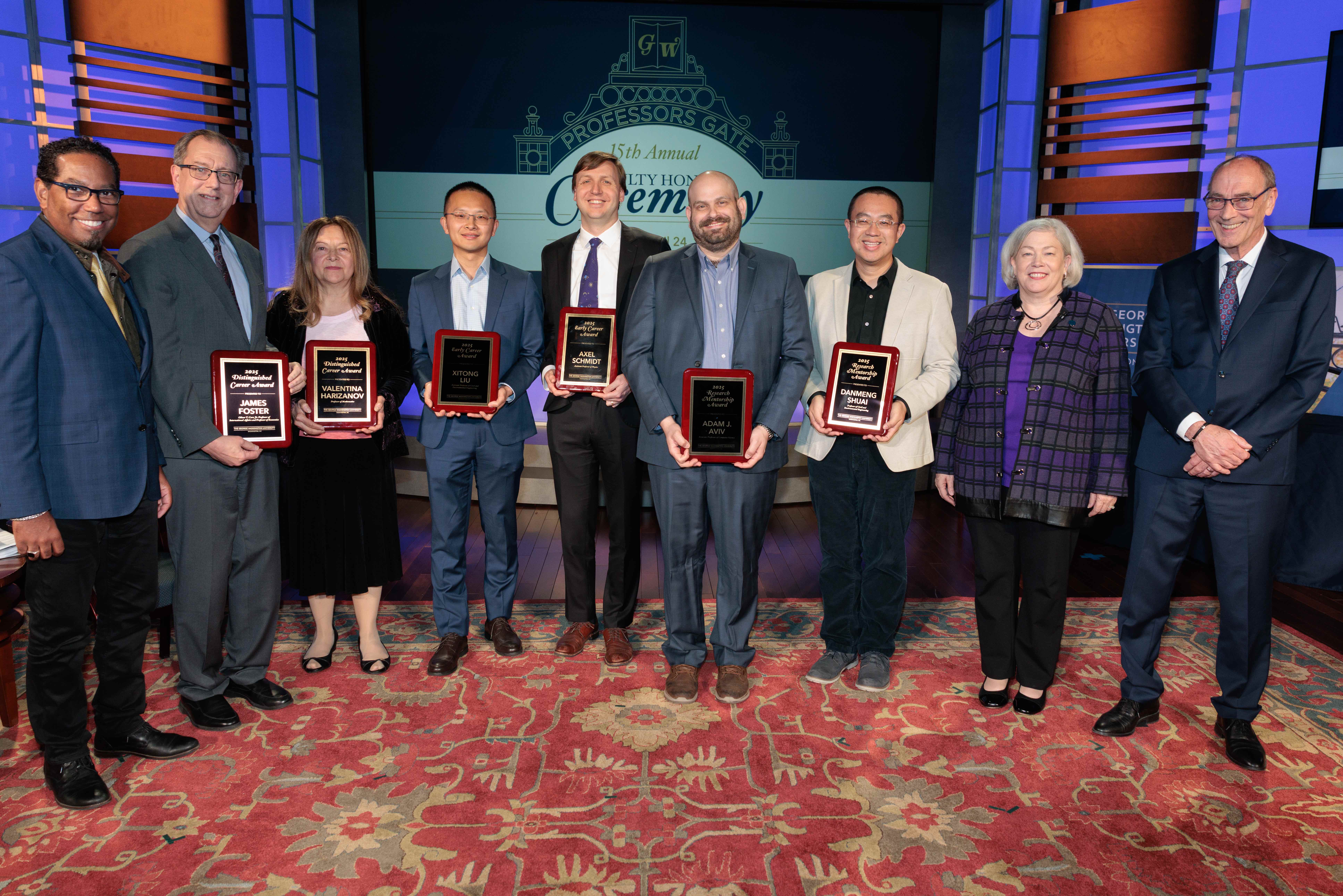 GW Engineering Professors Xitong Liu, Adam Aviv, and Danmeng Shuai pictured with their awards along GW leadership and fellow OVPR awardees.