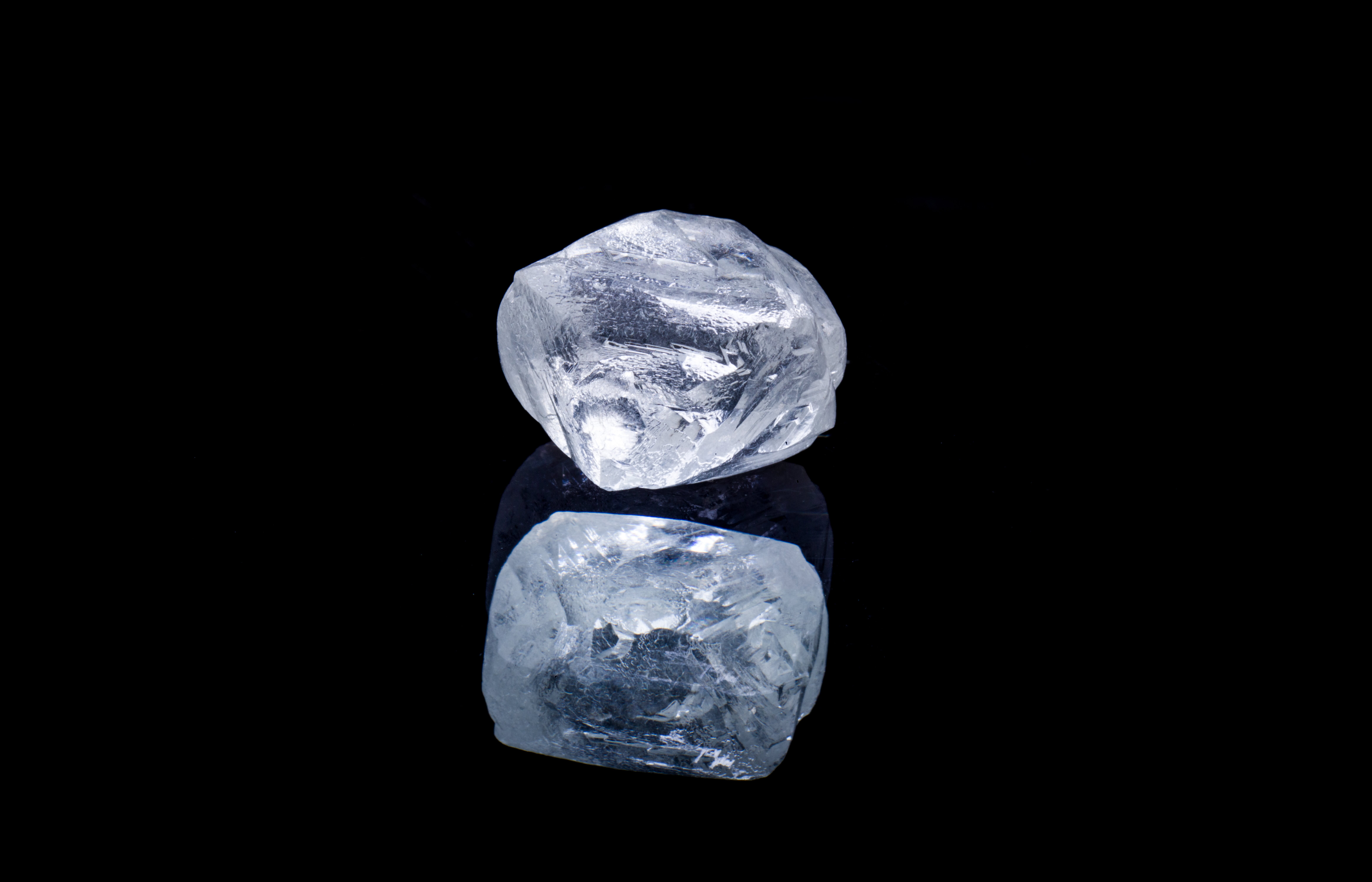 Raw diamond isolated on black background