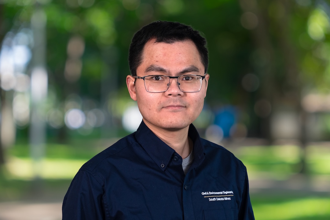 Man in a navy polo shirt