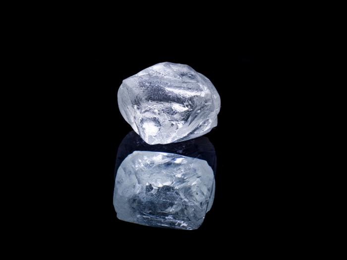 Raw diamond isolated on black background