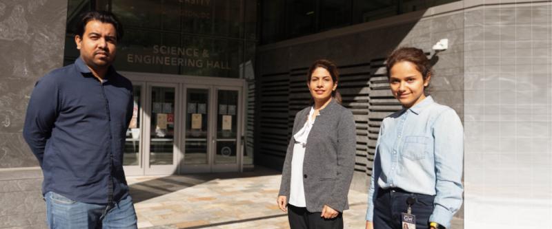 Professor Leila Farhadi and 2 students standing outside of the science and engineering hall 