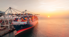 Ship being loaded at sunset