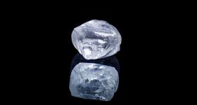 Raw diamond isolated on black background